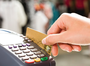 hand swiping a credit card