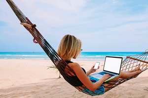 lady in a hammock with a laptop