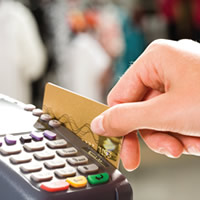 hand swiping a credit card