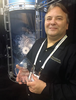 Christopher Dobiesz holding HME Business New Product Award