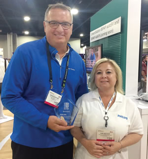 Kevin Dorcak and Kim Snyder with HME Business New Product Award